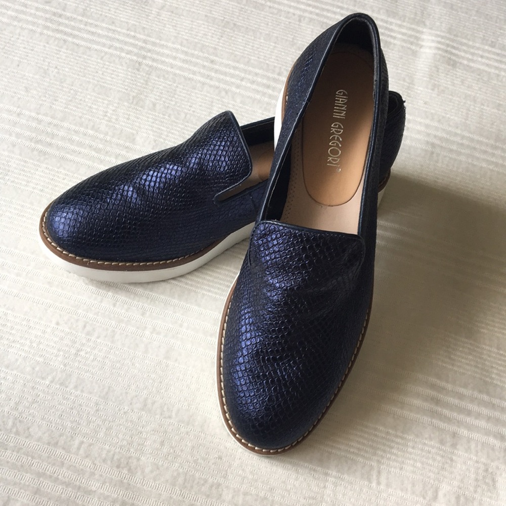 Metallic blue snake skin slip ons